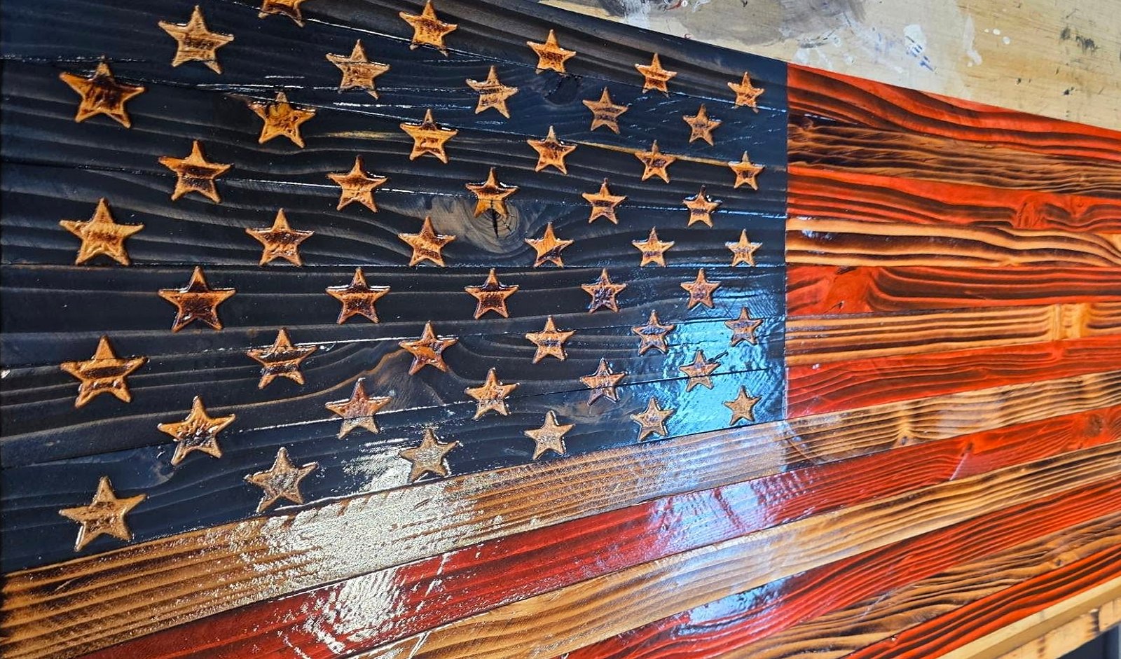 Blue star field with burnt red and orange stripes